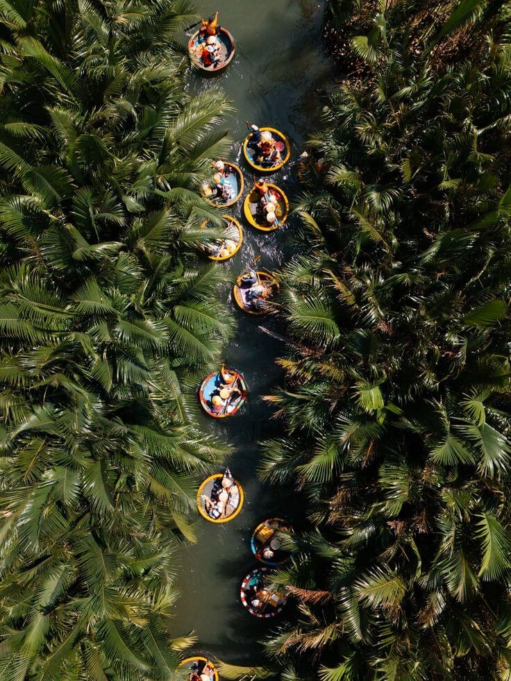 Indian family on coconut basket boat ride Hoi An