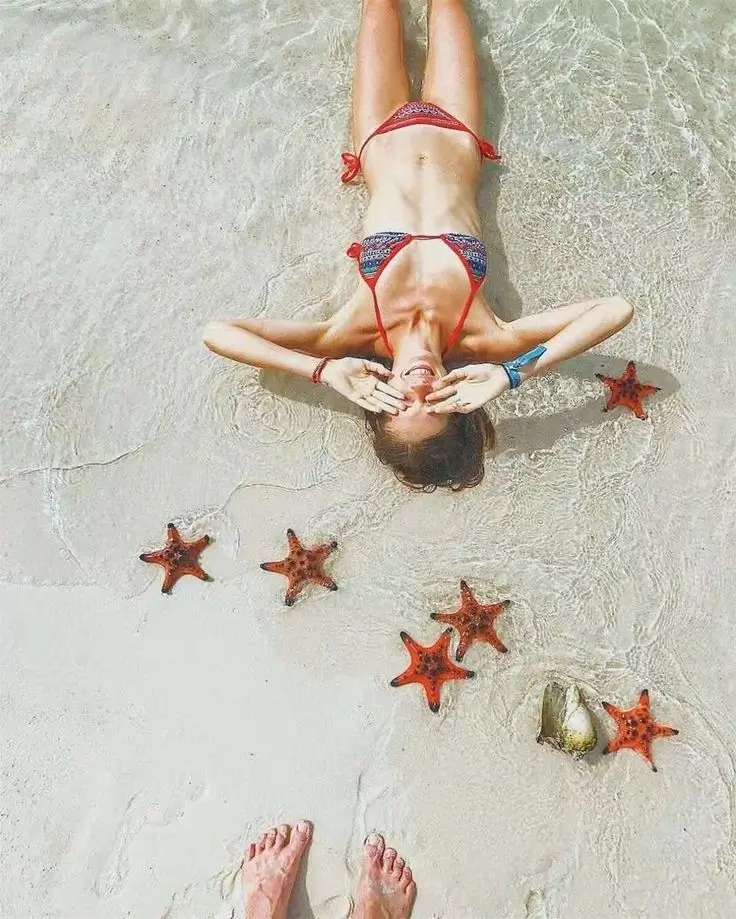 Starfish Beach (Bai Rach Vem) Phu Quoc - hundreds of orange starfish in clear water